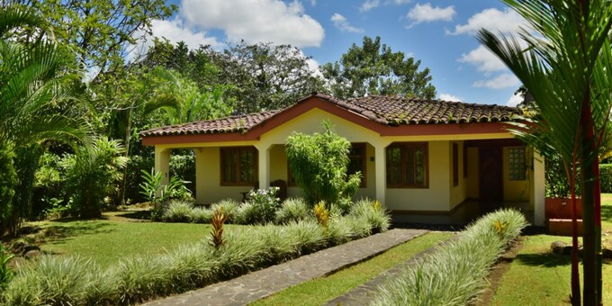 <p>Escape to the heart of El Castillo with Mirador House, a cozy two-bedroom vacation rental offering comfort and convenience for your Costa Rican getaway.  Just steps from the village center, this charming home features a fully equipped kitchen, a living room with a futon for extra sleeping space, and two air-conditioned bedrooms, each with a queen-size bed.  Enjoy the beautiful gardens, the gazebo with stunning volcano views, and the convenience of a laundry area.  Explore nearby attractions like Arenal Volcano, hanging bridges, and waterfalls, or simply relax and soak in the vibrant atmosphere of El Castillo.  Mirador House provides the perfect blend of tranquility and accessibility, making it an ideal choice for families or small groups seeking a memorable vacation.</p>